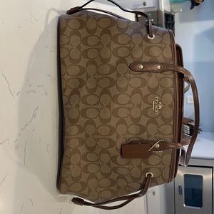 Brown/Tan Coach handbag. 16x9